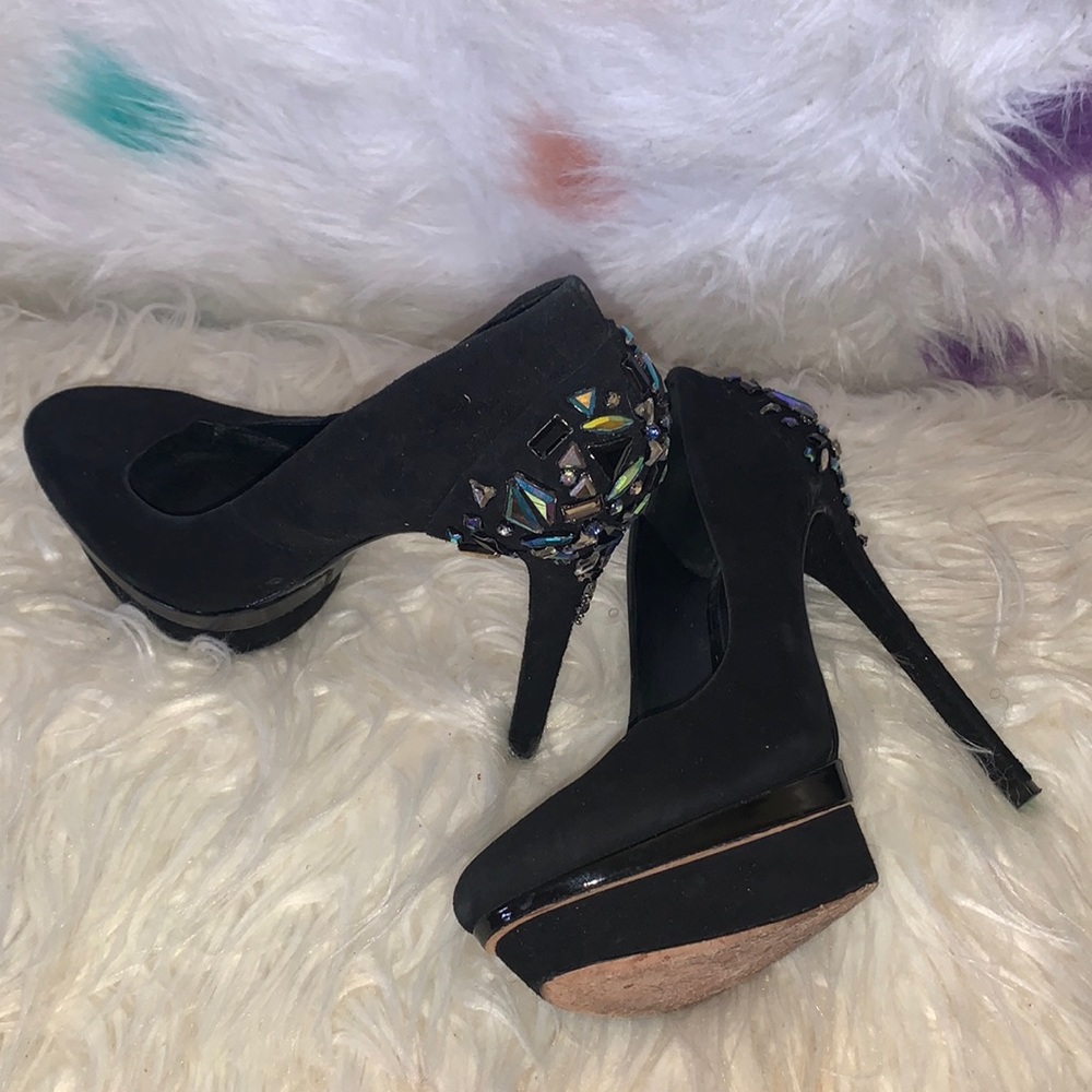 Tall black Brian Atwood pumps with rhinestones on the back